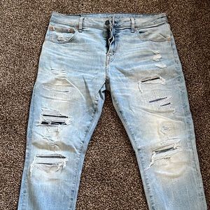 Distressed American Eagle athletic skinny mens jeans in light blue wash